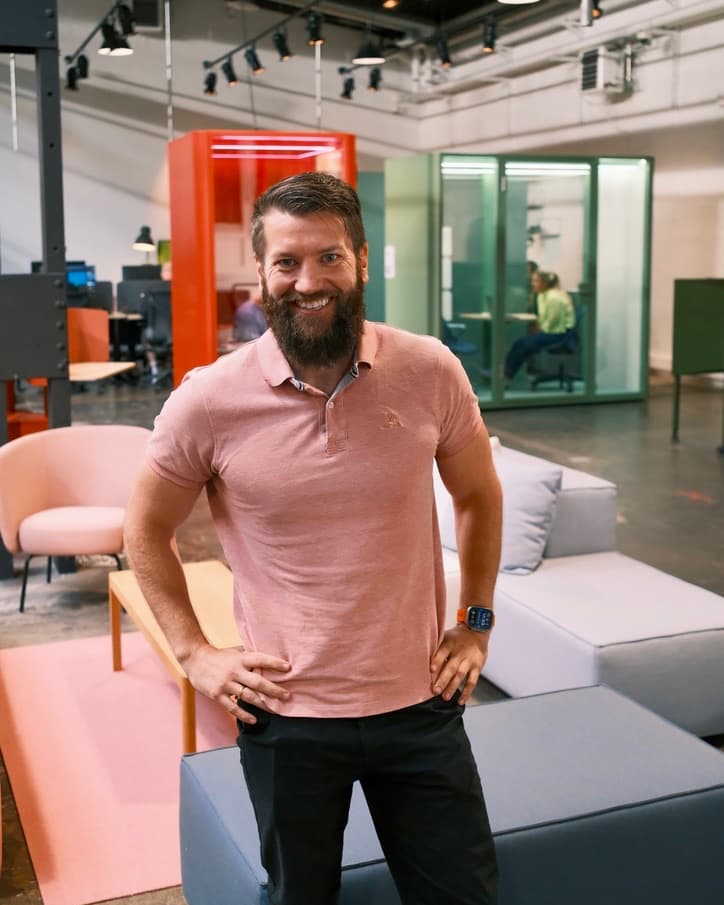 Tom Børvan, AI Lead & Project Manager at Alpha Solutions Norge, standing in an open-plan office